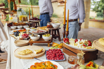 Midsection of man preparing food on table