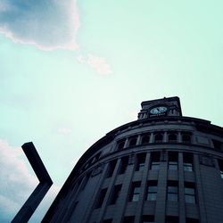 Low angle view of building against blue sky