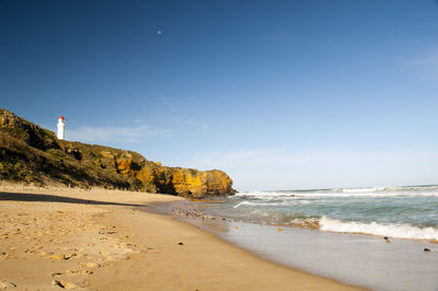 Scenic view of beach against clear sky