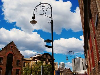 Low angle view of building against cloudy sky