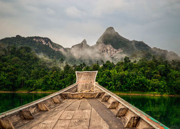 Boat on lake against mountains