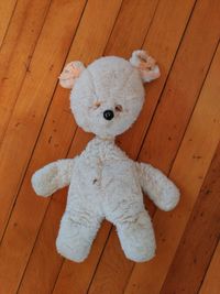 Close-up of stuffed toy on wooden floor