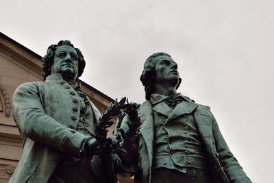 Low angle view of statue against sky