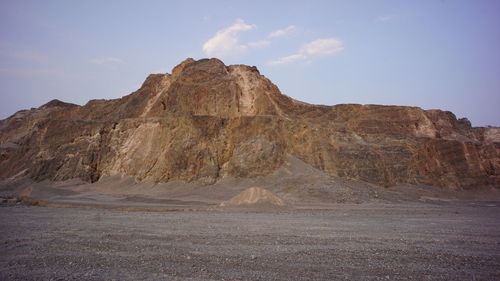 Rock formations in desert against sky