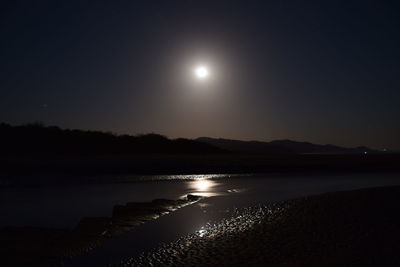 Scenic view of illuminated mountains at night