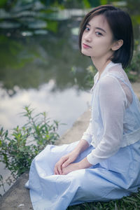 Young woman sitting outdoors