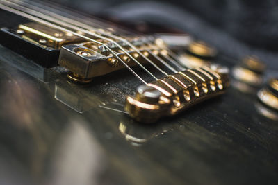 Close-up of guitar on table