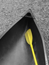 High angle view of yellow container on wet table