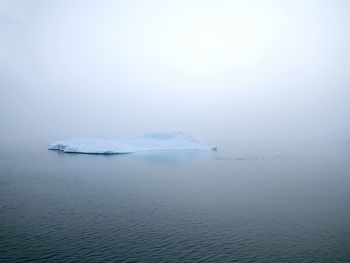 Scenic view of sea against sky during winter