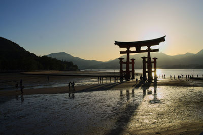 Scenic view of beach against clear sky