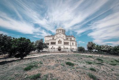 View of historical building against cloudy sky