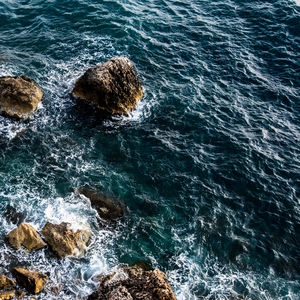 High angle view of rocks in sea