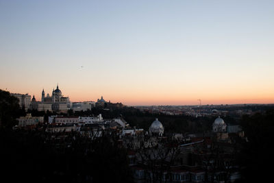 High angle view of buildings in city against clear sky