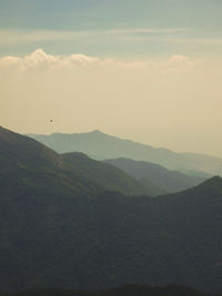 Scenic view of silhouette mountains against sky during sunset