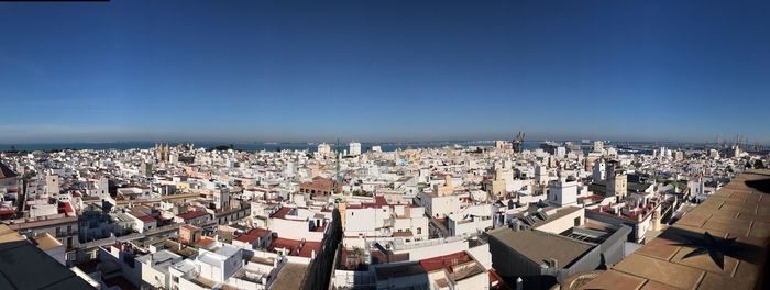 High angle view of townscape against blue sky