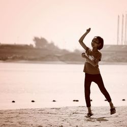 Woman standing on shore