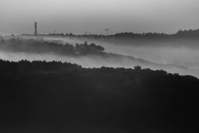 Scenic view of factory against sky