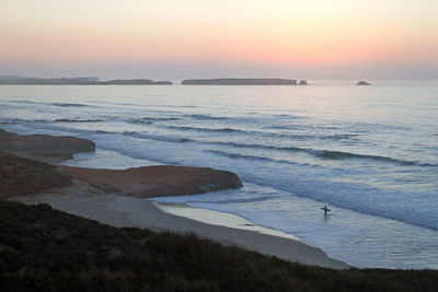 Scenic view of sea at sunset