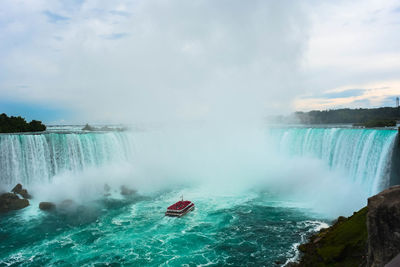 High angle view of niagara falls against cloudy sky