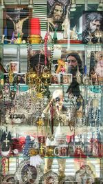 Digital composite image of people in store glass window