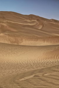 Scenic view of desert against clear sky