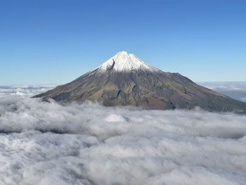 Scenic view of snowcapped volcano against clear sky