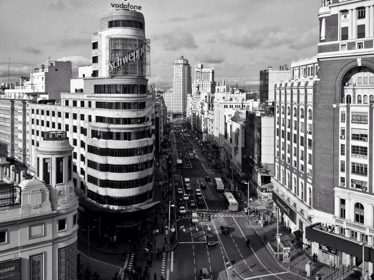 building exterior, architecture, built structure, city, sky, transportation, city life, cityscape, skyscraper, street, building, car, high angle view, office building, residential building, modern, cloud - sky, tall - high, city street, tower