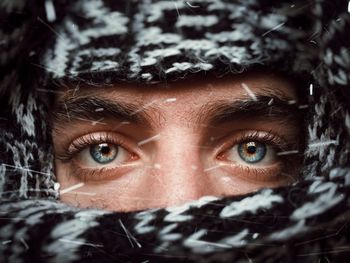 Close-up portrait of woman in winter