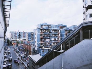 High angle view of buildings and street against sky