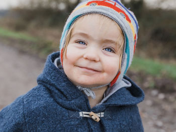 Portrait of cute girl in warm clothing