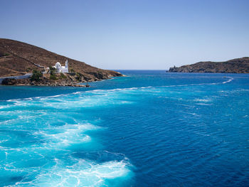 Scenic view of sea against clear blue sky