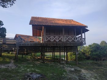 Exterior of building by trees against sky