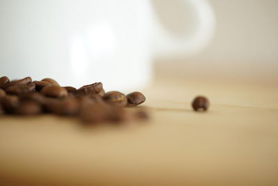 Close-up of coffee beans on table