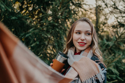 Portrait of beautiful woman drinking water