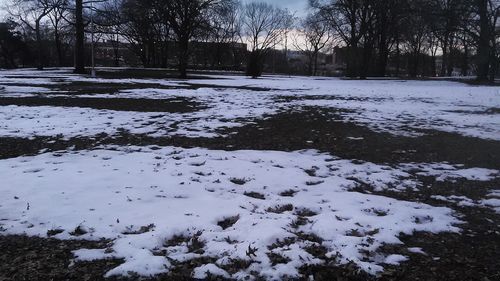 Snow covered landscape against sky