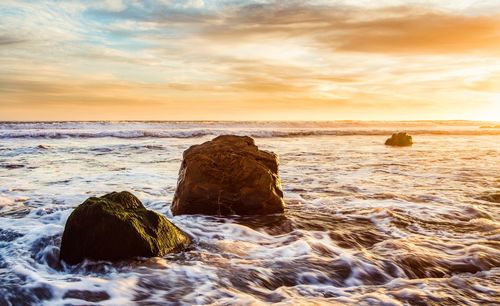 Scenic view of sea against sky during sunset