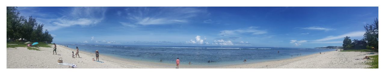 Panoramic view of beach against blue sky