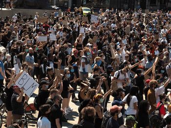 High angle view of people standing on street
