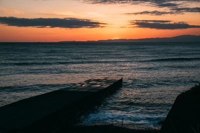 Scenic view of sea against sky during sunset