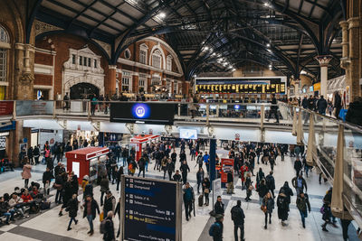 People walking on railroad station platform