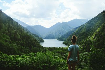 Rear view of woman looking at mountains