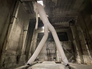 Low angle view of woman on staircase in building