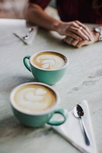 Coffee cups on table