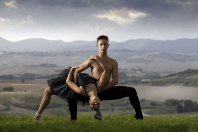 Portrait of ballet dancer dancing outdoors