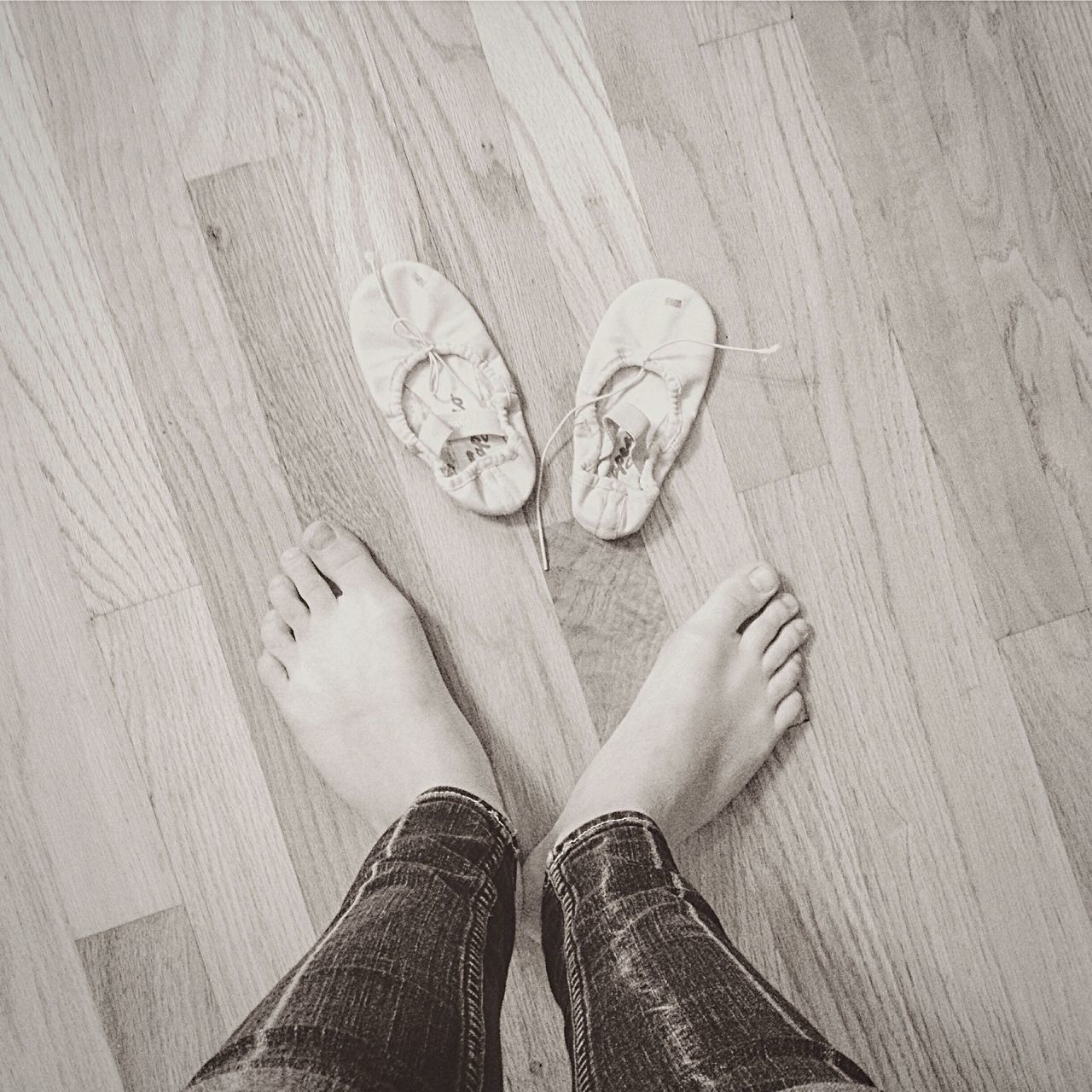 low section, person, shoe, personal perspective, high angle view, lifestyles, standing, human foot, indoors, jeans, footwear, leisure activity, men, shadow, unrecognizable person, pattern