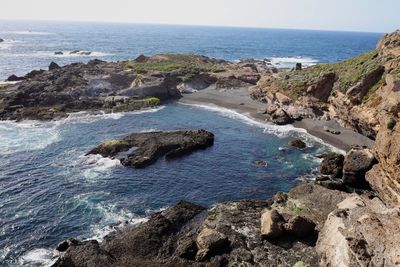 Scenic view of rock formations in sea