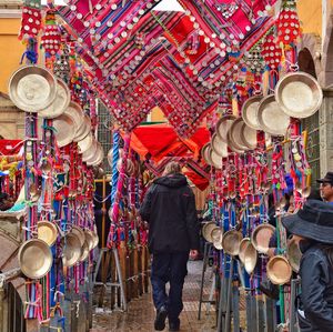 Rear view of man walking amidst decoration