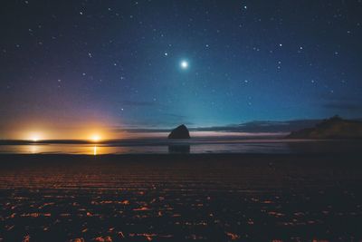 Scenic view of sea against sky at night