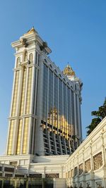 Low angle view of building against blue sky