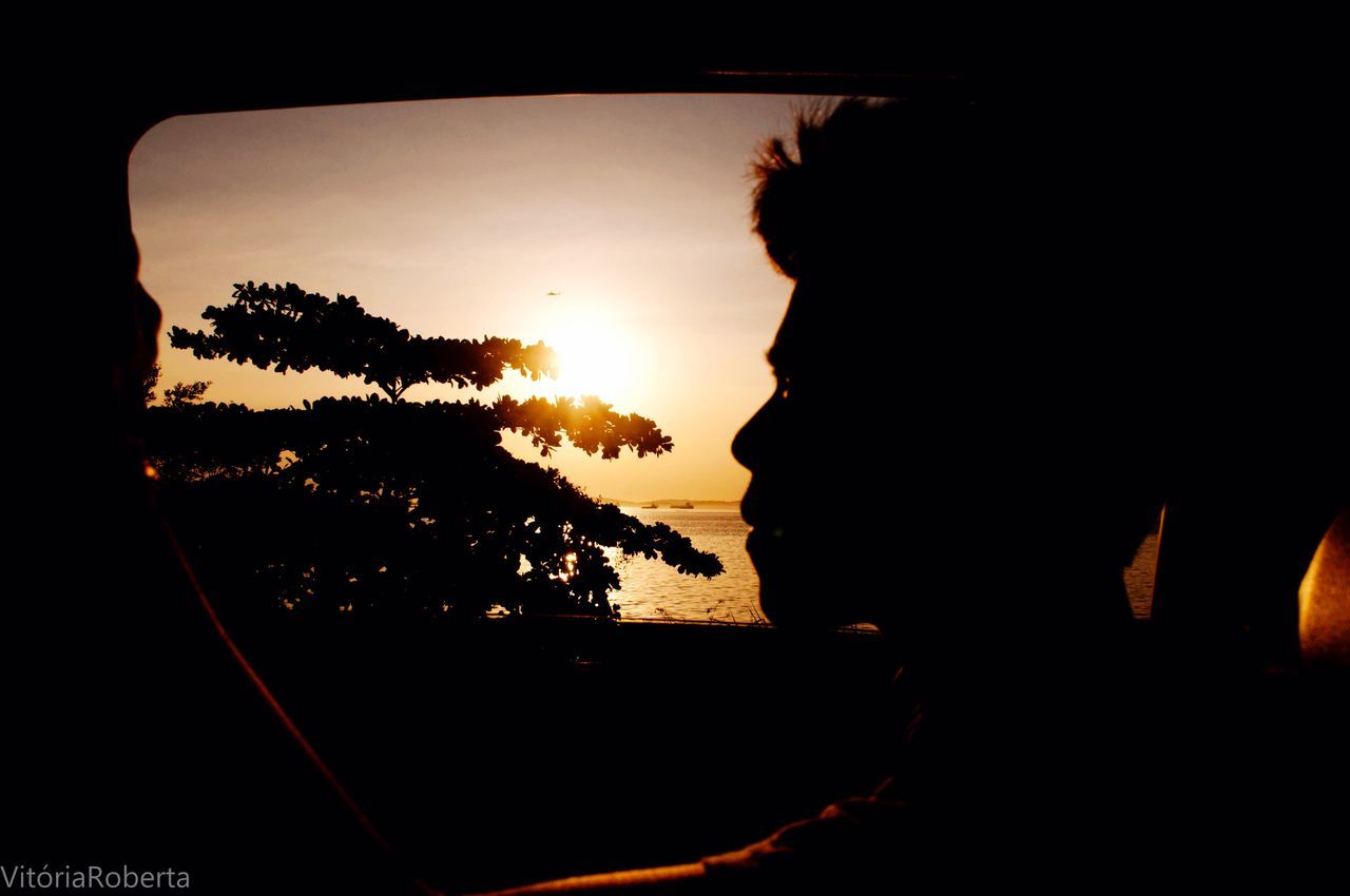 silhouette, sunset, sky, sun, sea, tranquility, scenics, tranquil scene, nature, tree, beauty in nature, water, sunlight, lifestyles, orange color, leisure activity, sitting, dark